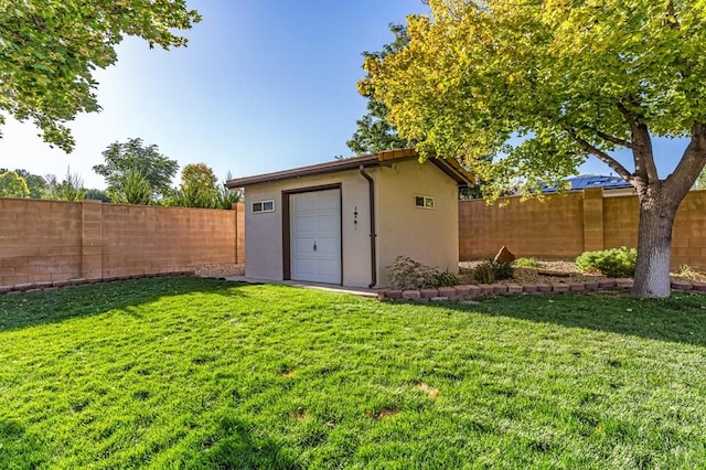 view of outbuilding with a fenced backyard and an outdoor structure