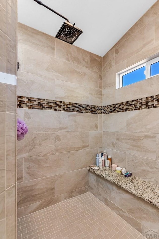 bathroom featuring tiled shower