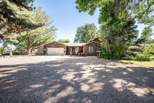 view of front facade with driveway and an attached garage