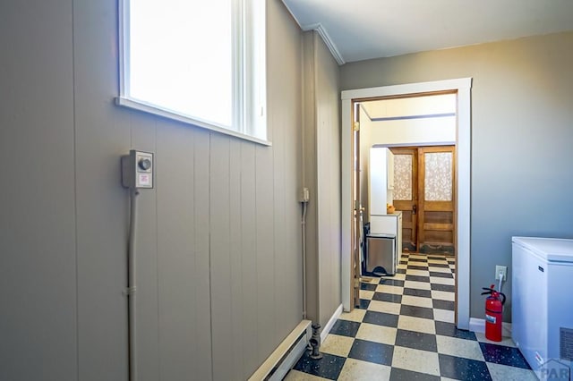 laundry room with tile patterned floors and laundry area