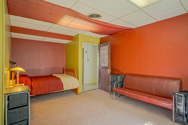 bedroom featuring visible vents, a paneled ceiling, and carpet floors