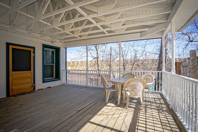 wooden deck with outdoor dining space