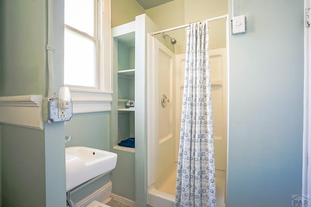 bathroom with a shower with curtain