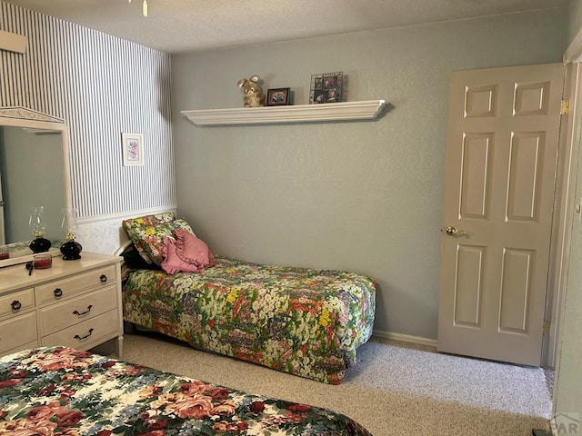 carpeted bedroom with baseboards