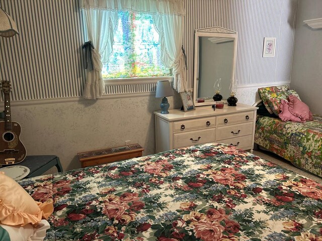 bedroom featuring wallpapered walls