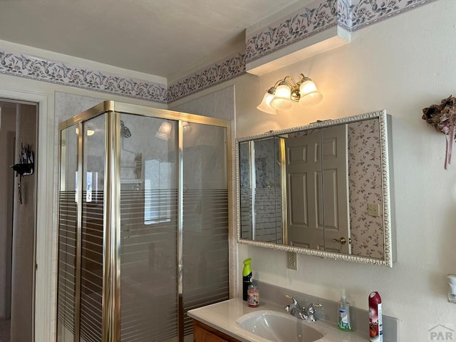 full bathroom with vanity and a shower stall