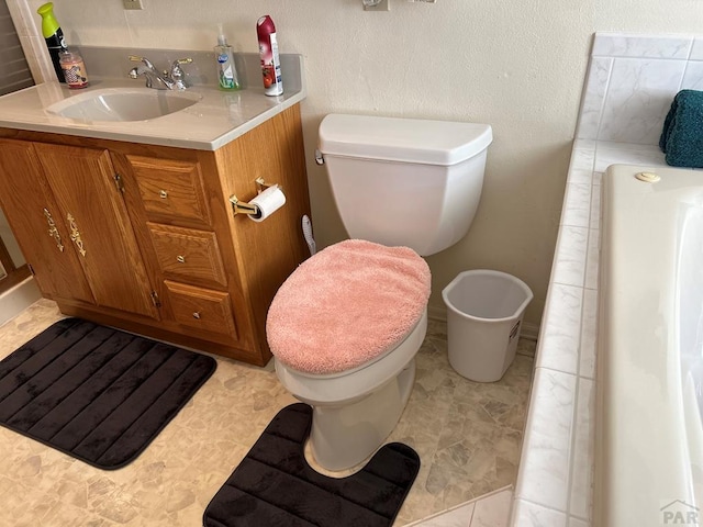 full bath featuring vanity and toilet