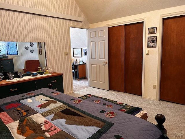 bedroom with vaulted ceiling and light carpet