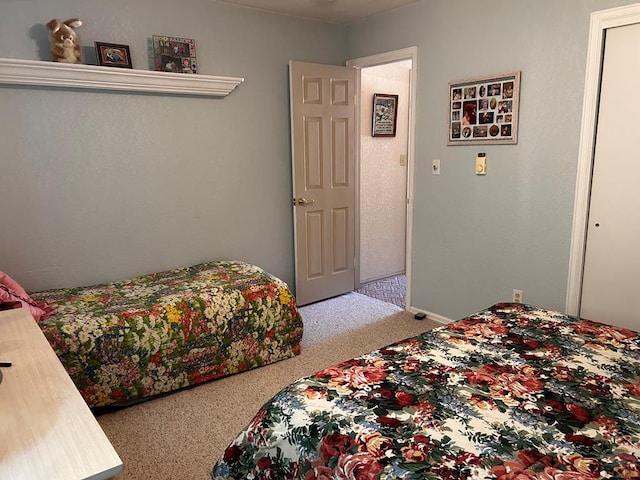 bedroom featuring light carpet