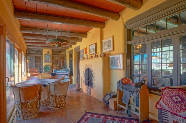 dining room featuring wooden ceiling and beamed ceiling