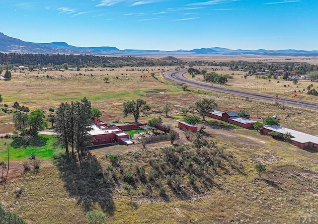 drone / aerial view featuring a rural view and a mountain view