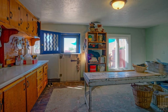 kitchen with brown cabinets and light countertops