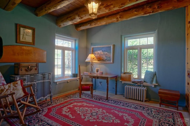 sitting room featuring radiator, wood ceiling, baseboards, and beam ceiling