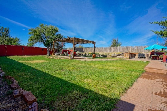 view of yard featuring a fenced backyard, a pergola, and a patio