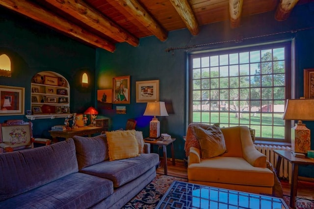 living room featuring wooden ceiling, a healthy amount of sunlight, and beam ceiling