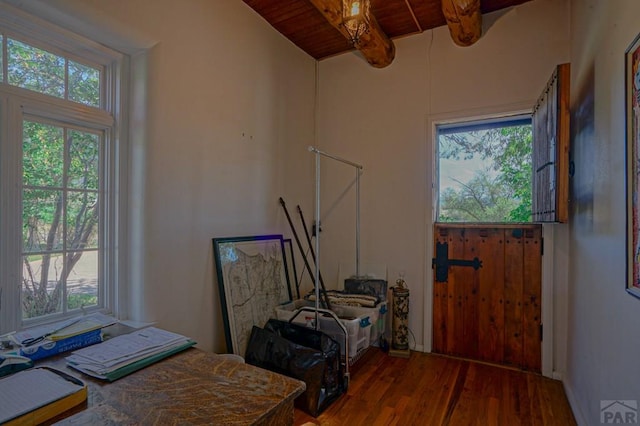 home office featuring wooden ceiling, wood finished floors, and beam ceiling