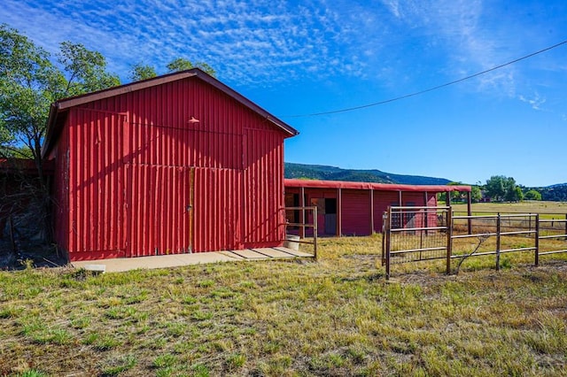 view of outbuilding featuring an outbuilding and fence