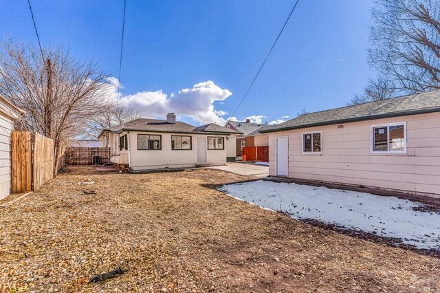 back of house with a patio, a chimney, and a fenced backyard