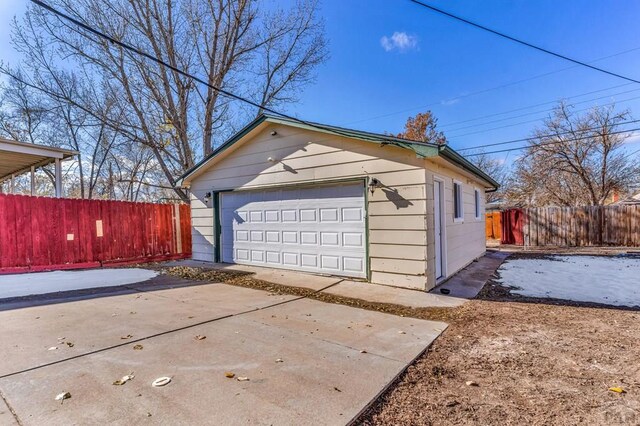 detached garage with fence