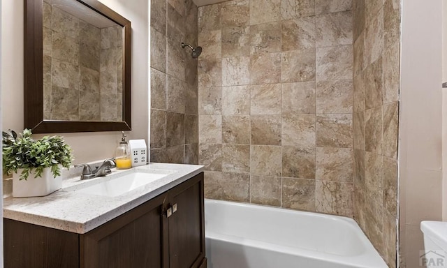 bathroom featuring vanity, toilet, and bathing tub / shower combination