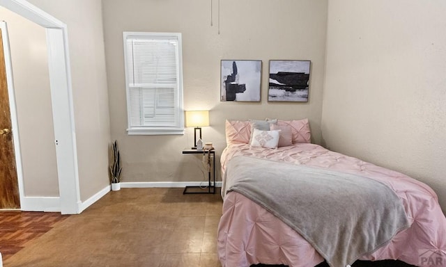 bedroom featuring baseboards