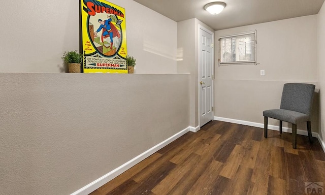 entryway featuring dark wood-style flooring and baseboards