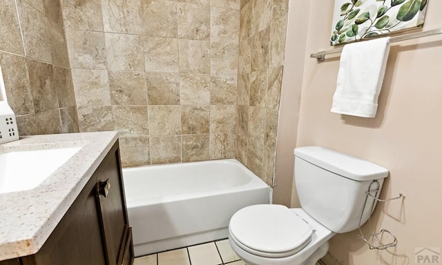 bathroom featuring toilet, tile patterned flooring, and vanity