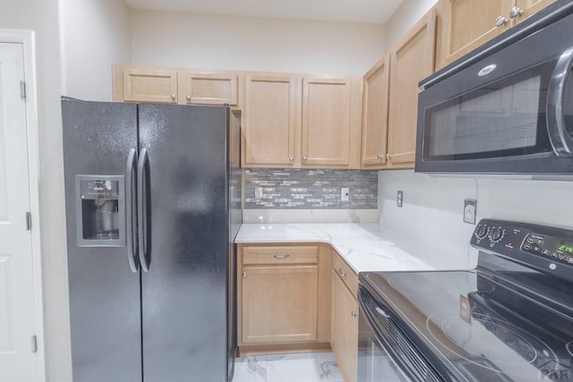 7639 Sandy Springs Pt, Fountain, CO 80817 - kitchen with black appliances, light brown cabinets, light marble finish flooring, light stone counters, and backsplash