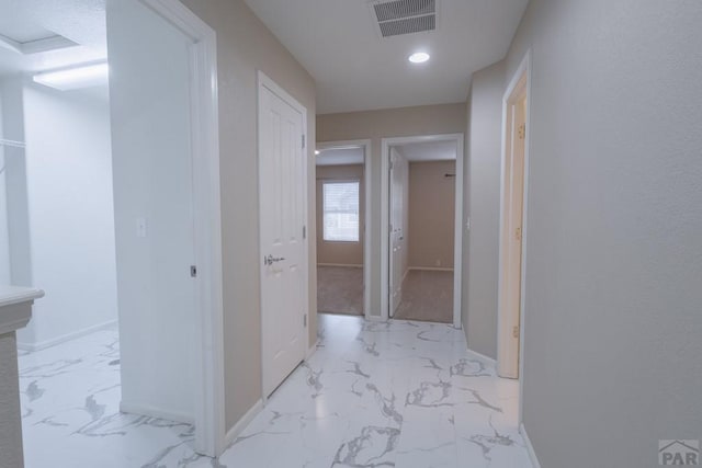 7639 Sandy Springs Pt, Fountain, CO 80817 - corridor with light marble finish flooring, baseboards, and recessed lighting