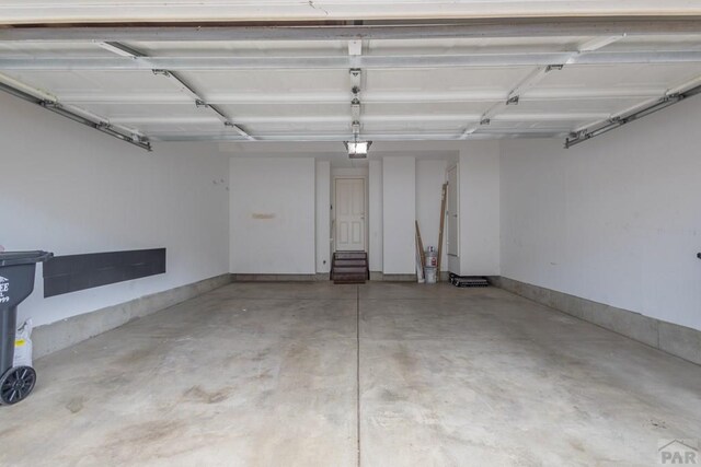 7639 Sandy Springs Pt, Fountain, CO 80817 - garage featuring a garage door opener