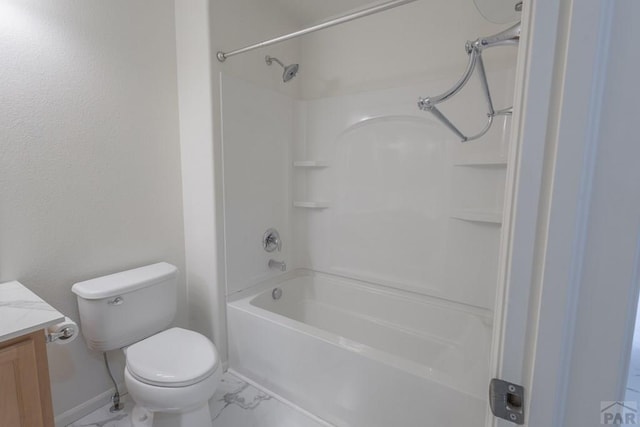 7639 Sandy Springs Pt, Fountain, CO 80817 - bathroom featuring vanity, bathing tub / shower combination, toilet, marble look tiles, and baseboards