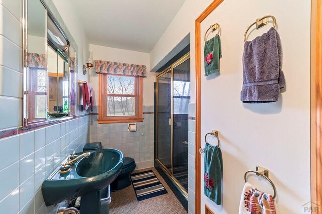 10511 Apache City Rd, Rye, CO 81069 - full bath with a stall shower, tile walls, and wainscoting