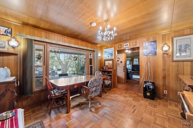 10511 Apache City Rd, Rye, CO 81069 - dining space featuring an inviting chandelier, wood walls, and wood ceiling