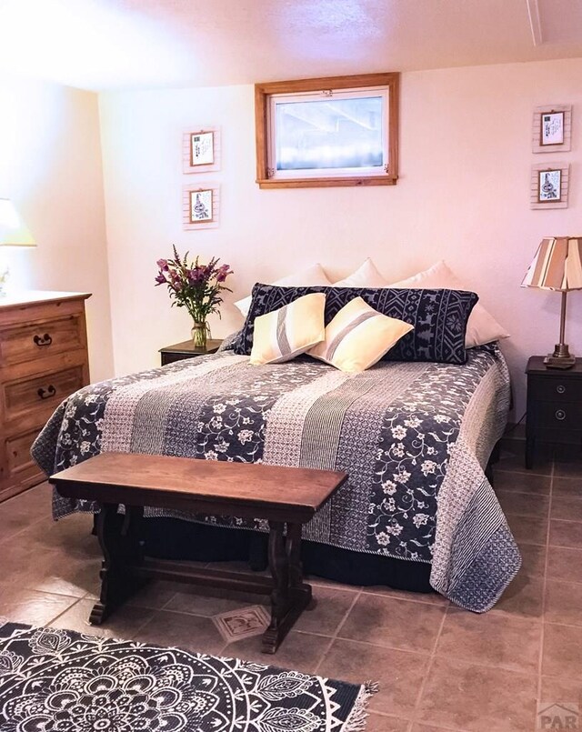 bedroom featuring tile patterned floors