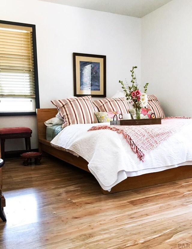 bedroom featuring wood finished floors