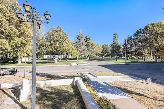 view of road with curbs and sidewalks