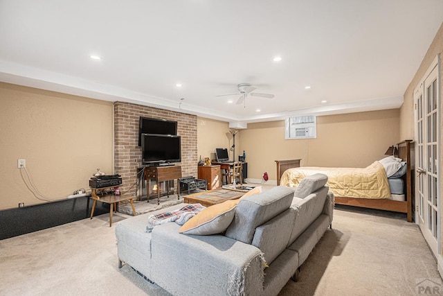 interior space with a ceiling fan, recessed lighting, a wall mounted air conditioner, and light carpet