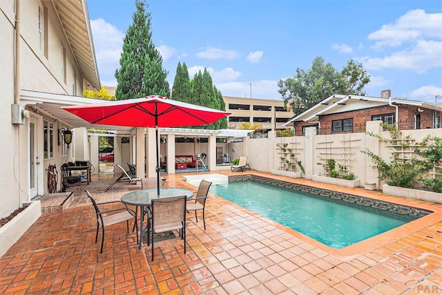 view of swimming pool featuring a fenced in pool, a patio, outdoor dining space, a pergola, and fence private yard