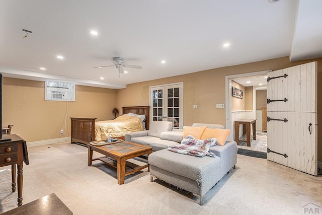 living area with baseboards, ceiling fan, french doors, and recessed lighting