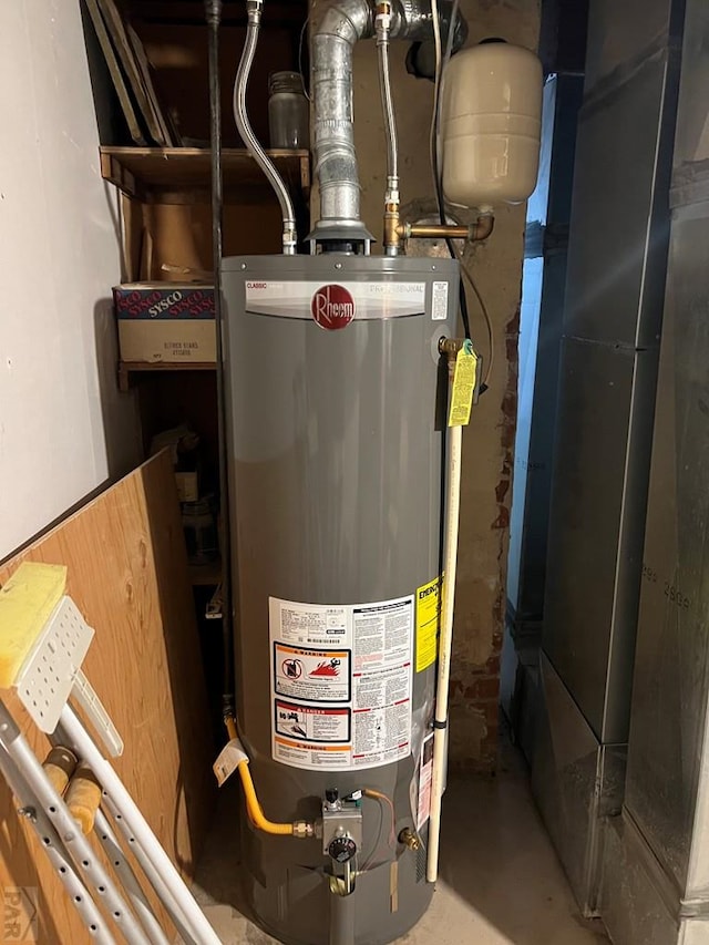 utility room featuring gas water heater