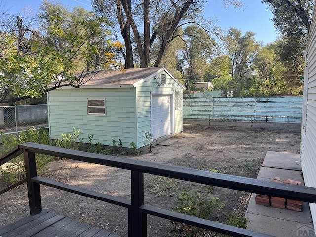 view of outbuilding featuring a fenced backyard and an outdoor structure