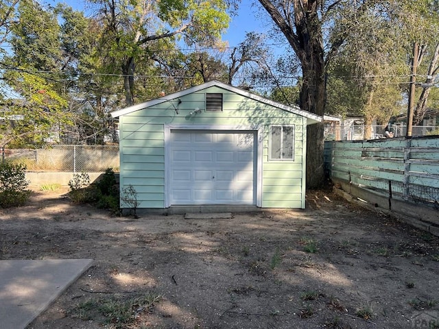 detached garage with fence