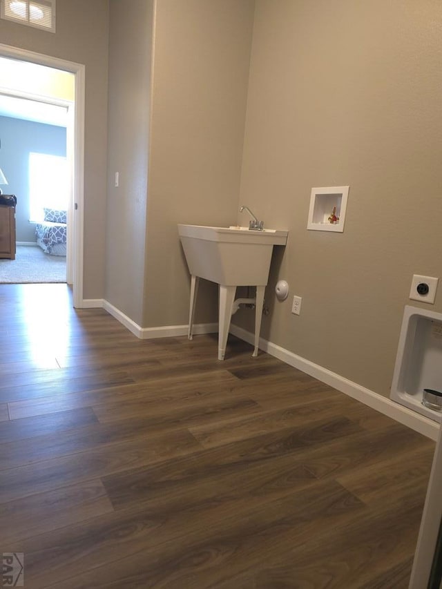 980 N Purcell Blvd, Pueblo West, CO 81007 - laundry room with baseboards, hookup for a washing machine, laundry area, and dark wood finished floors
