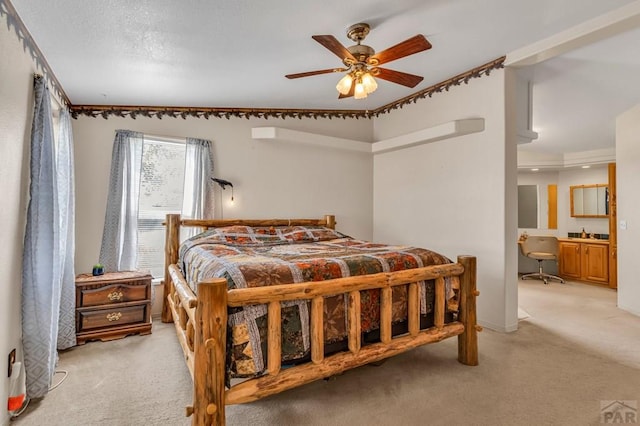 bedroom with light carpet and a ceiling fan