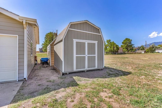 view of shed featuring fence