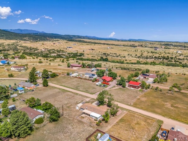 birds eye view of property with a mountain view