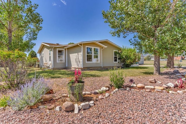 ranch-style house with a front lawn