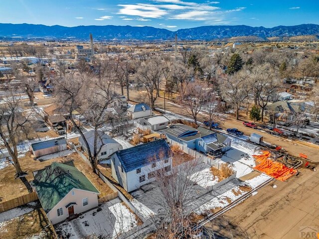 drone / aerial view featuring a residential view and a mountain view