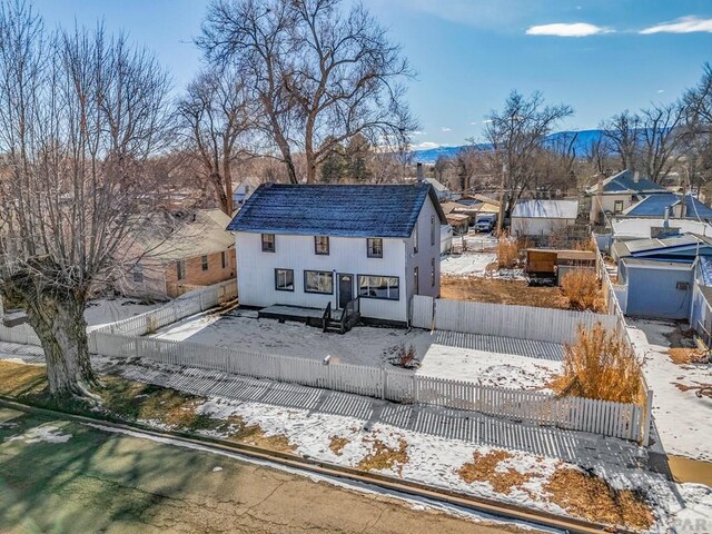 view of front of house with a fenced front yard and a residential view