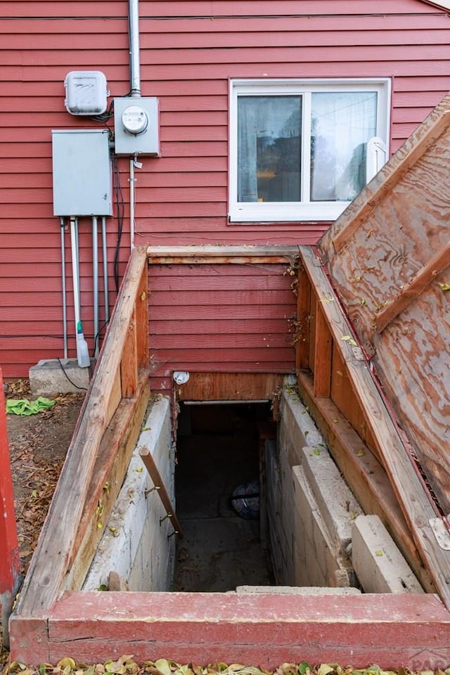 details featuring electric meter and a bulkhead entry